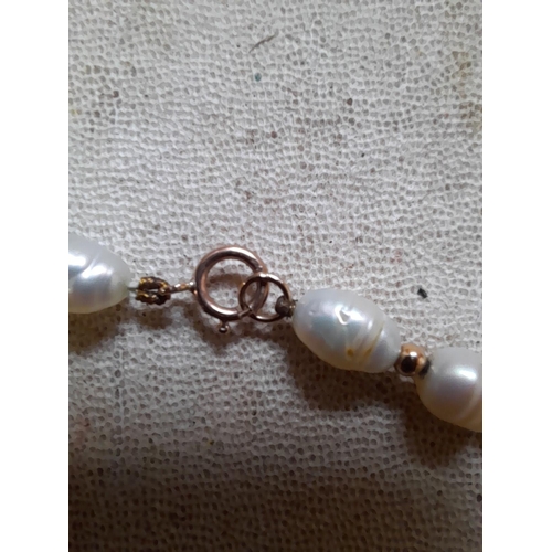 58 - Potato pearl and 9 ct gold necklace, bracelet and earring set