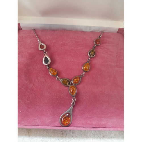 64 - Small collection of amber and mainly silver costume jewellery : necklaces, earrings etc.