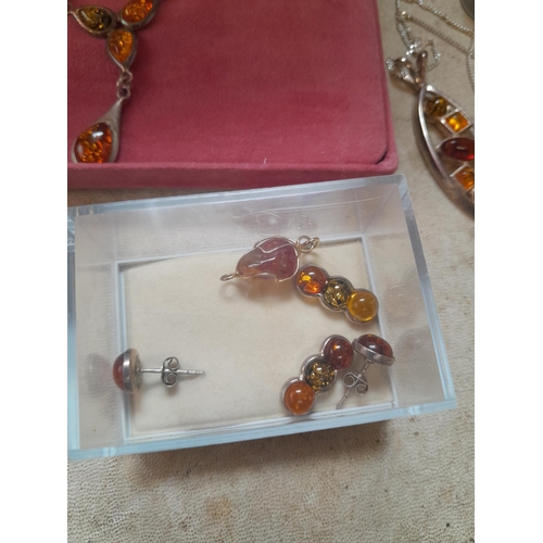 64 - Small collection of amber and mainly silver costume jewellery : necklaces, earrings etc.