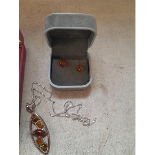 64 - Small collection of amber and mainly silver costume jewellery : necklaces, earrings etc.