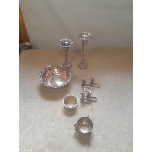 209 - Assorted silver items : pair of knife rests, silver spill vases, repousse work bowl, serviette ring ... 