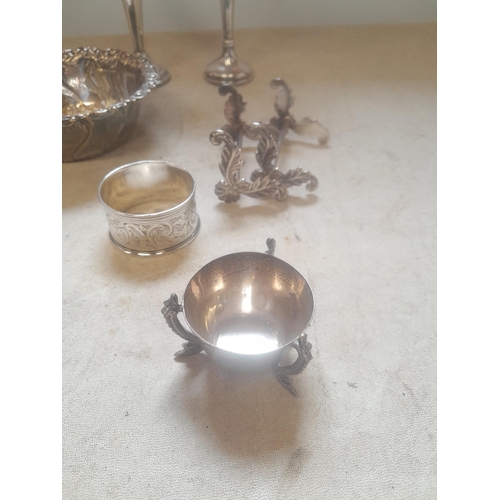 209 - Assorted silver items : pair of knife rests, silver spill vases, repousse work bowl, serviette ring ... 