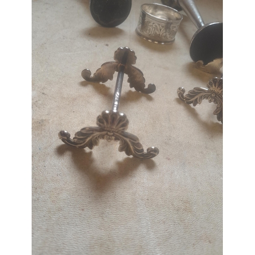 209 - Assorted silver items : pair of knife rests, silver spill vases, repousse work bowl, serviette ring ... 