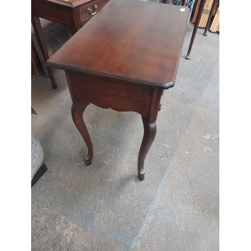 53 - Vintage mahogany side table on wavy legs with single drawers 74 cms x  44 cms x 77 cms