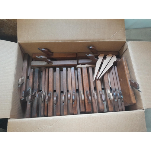 115 - Approx 23 antique wooden moulding planes