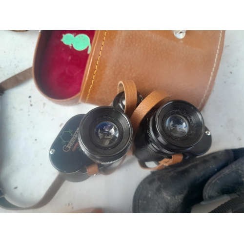 21 - Assorted binoculars : Minolta Compact II, Ranger 12 x 50, Green Kat & Pathescope 8 x 30 etc.