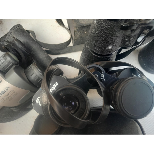 21 - Assorted binoculars : Minolta Compact II, Ranger 12 x 50, Green Kat & Pathescope 8 x 30 etc.