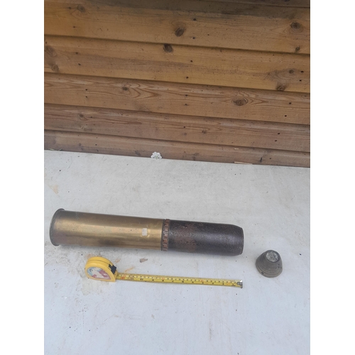 56 - 18 Pounder brass artillery shell case with cast sleeve and detonator