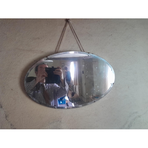 34 - Frameless wall mirror, small barometer and plated ware