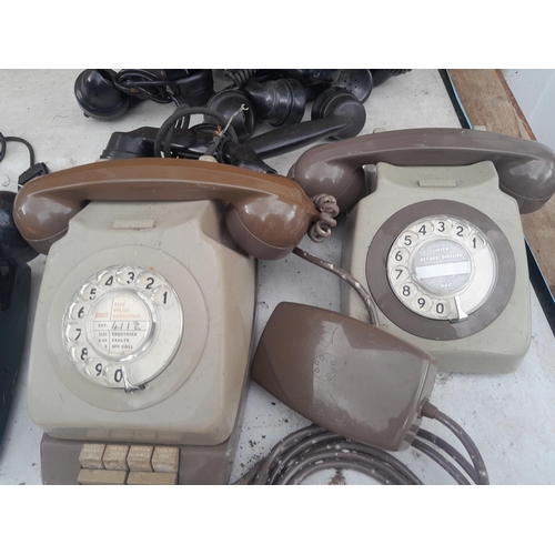 60 - Various plastic telephones, some hand sets for spares