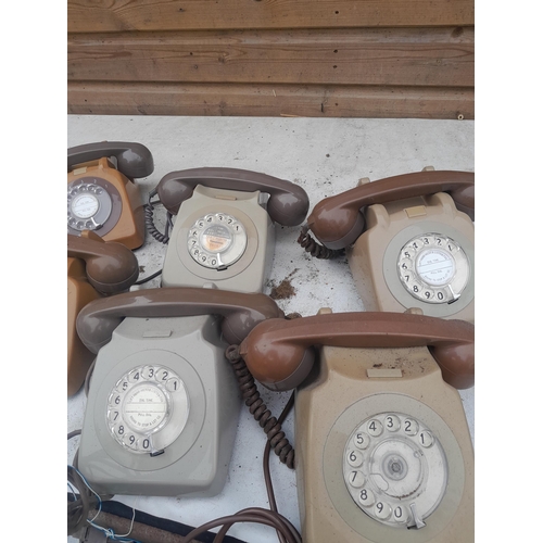 65 - Collection of vintage plastic telephones & a box of diallers for spares