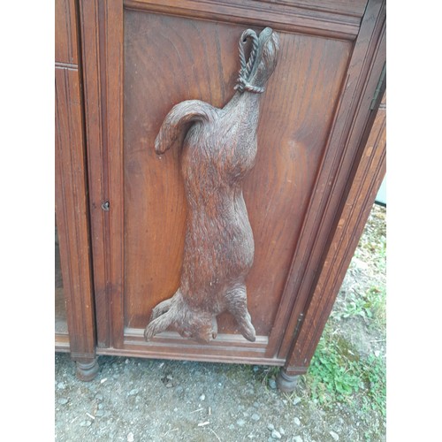 137 - Victorian heavily carved oak sideboard with well carved applied models of game and fish, note this l... 