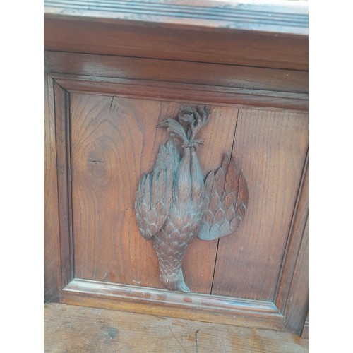 137 - Victorian heavily carved oak sideboard with well carved applied models of game and fish, note this l... 