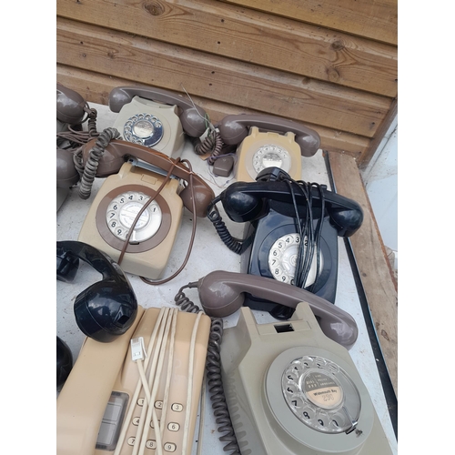 144 - Box of various plastic telephone including trimphone