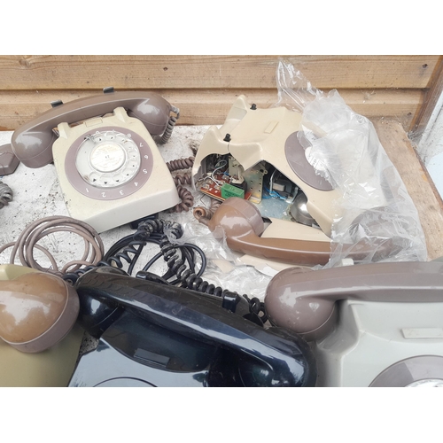 158 - Various plastic telephones and wooden crate of telephone repair accessories including braided flex