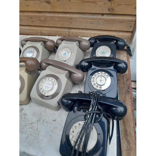 165 - Various plastic telephones