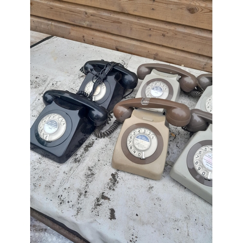 165 - Various plastic telephones