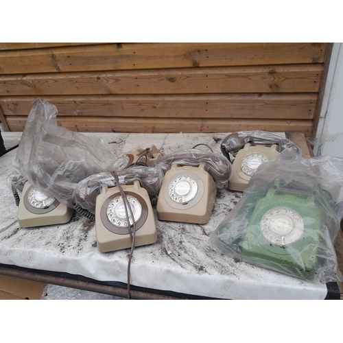 165 - Various plastic telephones