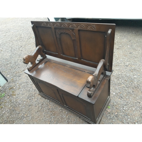 236 - Vintage oak Monks seat / table with carved lion arm rest