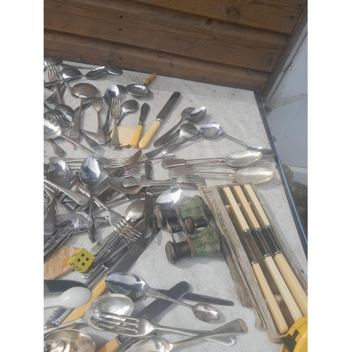 11 - Silver plated and other cutlery and storm lamp