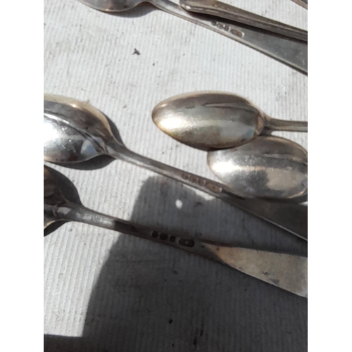 12 - Silver items : silver salts, various silver teaspoons , small silver cream jug, various dates makers... 