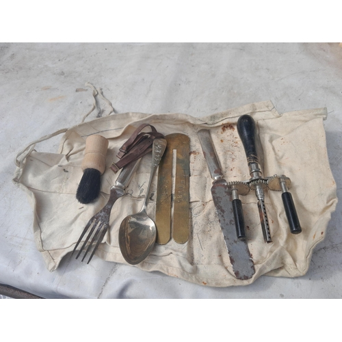 34 - World War II era gas masks and cutlery roll