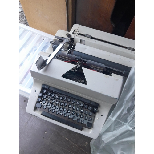 106 - Vintage typewriter and box of Heron Publishing books