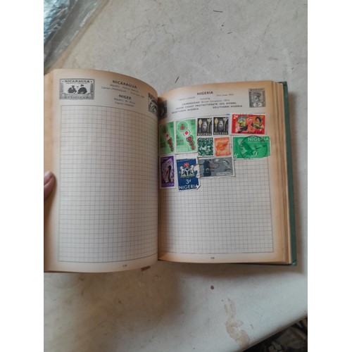 306 - Sparsely filled album of used stamps of the world and loose mint and used stamps