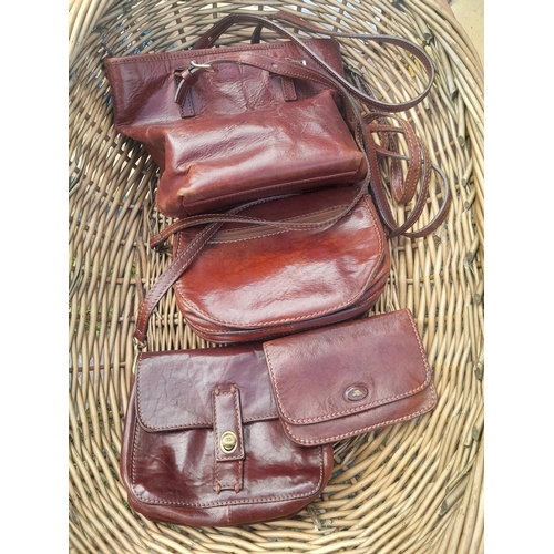 61 - 4 x vintage leather bags by The Bridge in a wicker basket