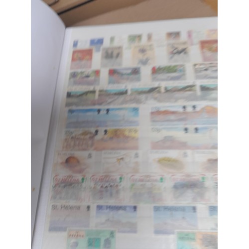 4 - Assorted stamp stock books and loose pages with mint and used QEII era Commonwealth, badly stored wi... 