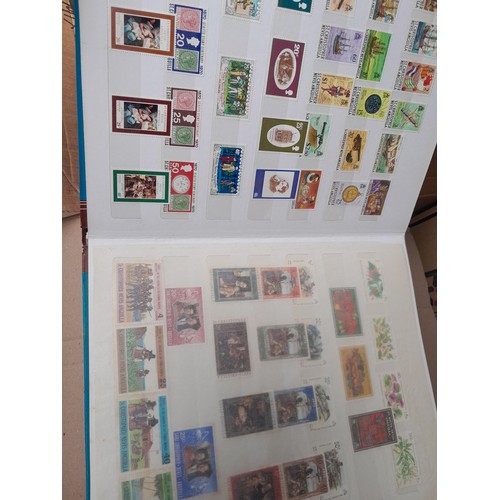 4 - Assorted stamp stock books and loose pages with mint and used QEII era Commonwealth, badly stored wi... 