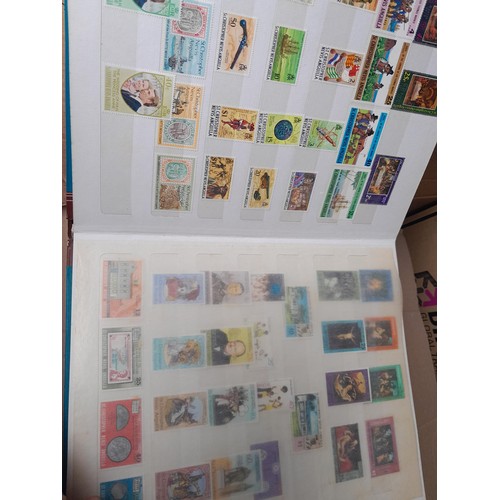 4 - Assorted stamp stock books and loose pages with mint and used QEII era Commonwealth, badly stored wi... 