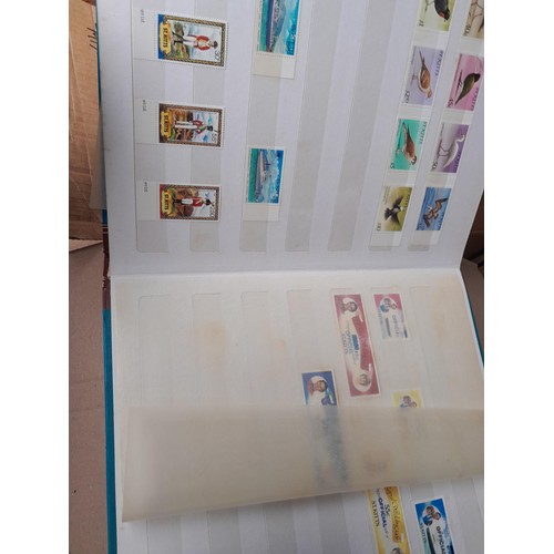 4 - Assorted stamp stock books and loose pages with mint and used QEII era Commonwealth, badly stored wi... 