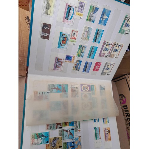 4 - Assorted stamp stock books and loose pages with mint and used QEII era Commonwealth, badly stored wi... 