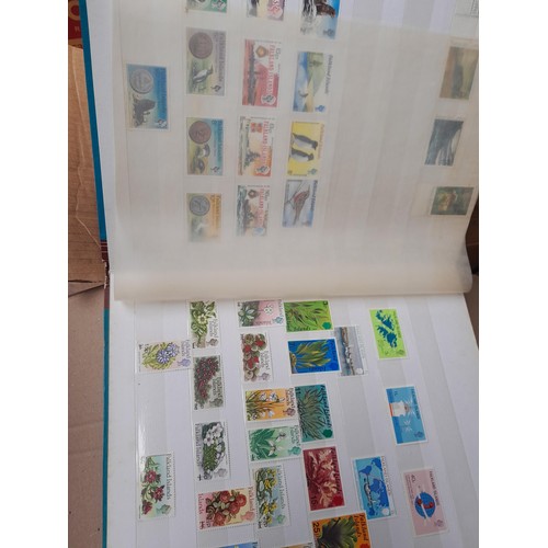 4 - Assorted stamp stock books and loose pages with mint and used QEII era Commonwealth, badly stored wi... 