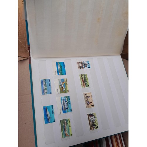 4 - Assorted stamp stock books and loose pages with mint and used QEII era Commonwealth, badly stored wi... 