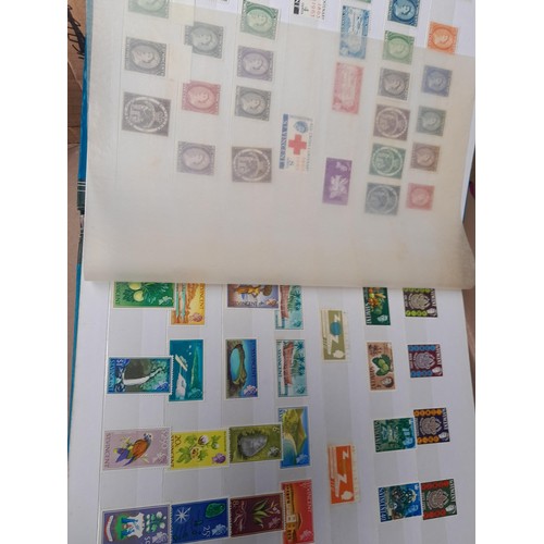 4 - Assorted stamp stock books and loose pages with mint and used QEII era Commonwealth, badly stored wi... 