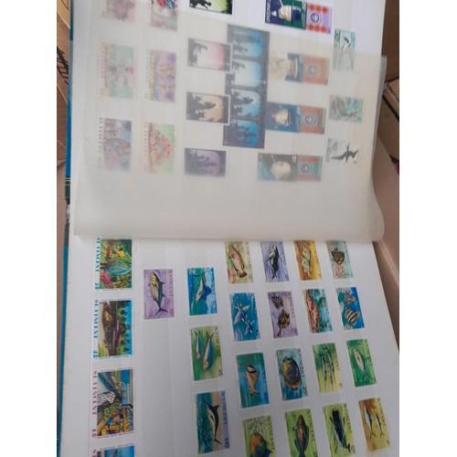 4 - Assorted stamp stock books and loose pages with mint and used QEII era Commonwealth, badly stored wi... 