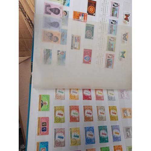 4 - Assorted stamp stock books and loose pages with mint and used QEII era Commonwealth, badly stored wi... 