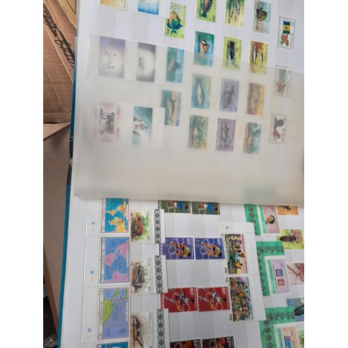 4 - Assorted stamp stock books and loose pages with mint and used QEII era Commonwealth, badly stored wi... 