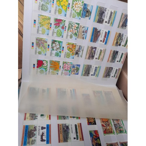 4 - Assorted stamp stock books and loose pages with mint and used QEII era Commonwealth, badly stored wi... 