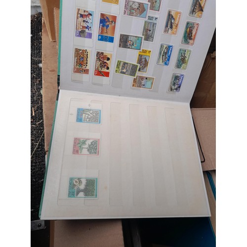 4 - Assorted stamp stock books and loose pages with mint and used QEII era Commonwealth, badly stored wi... 