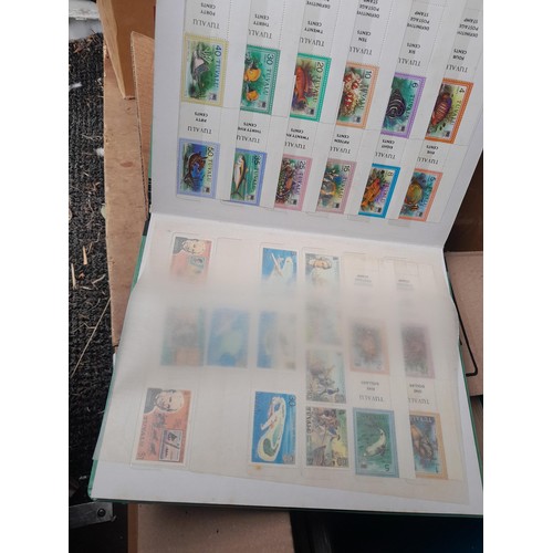 4 - Assorted stamp stock books and loose pages with mint and used QEII era Commonwealth, badly stored wi... 