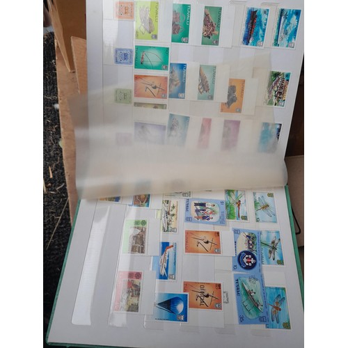 4 - Assorted stamp stock books and loose pages with mint and used QEII era Commonwealth, badly stored wi... 