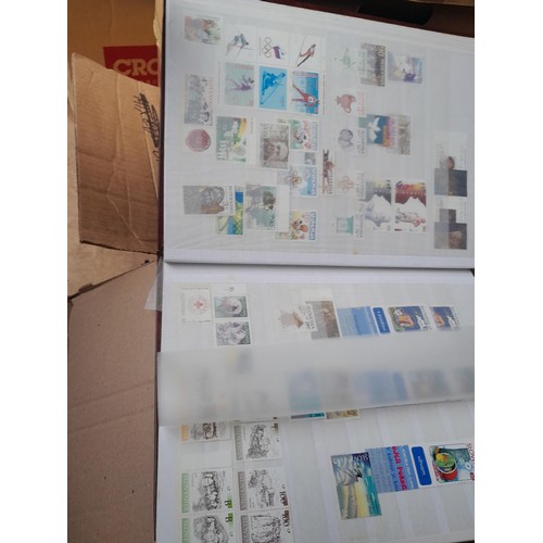 4 - Assorted stamp stock books and loose pages with mint and used QEII era Commonwealth, badly stored wi... 