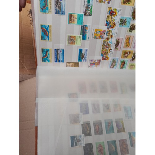 4 - Assorted stamp stock books and loose pages with mint and used QEII era Commonwealth, badly stored wi... 