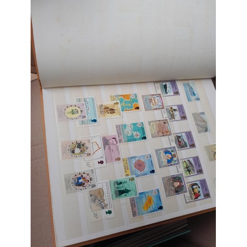 4 - Assorted stamp stock books and loose pages with mint and used QEII era Commonwealth, badly stored wi... 