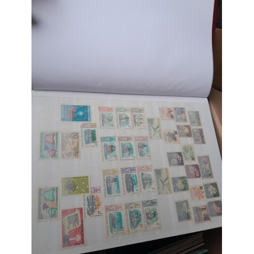 4 - Assorted stamp stock books and loose pages with mint and used QEII era Commonwealth, badly stored wi... 