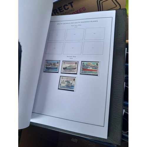 7 - Stamps of South Atlantic in 7 x blue binders with printed pages for all issues to 2014 for Falklands... 