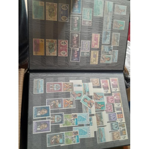 15 - Assorted stamp stock books and loose pages with mint and used QEII era Commonwealth, badly stored wi... 